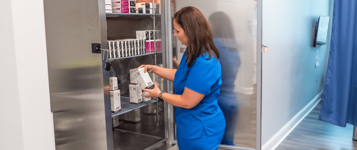 Infusion Care of East Alabama, Auburn nurse checking medication in storage cooler